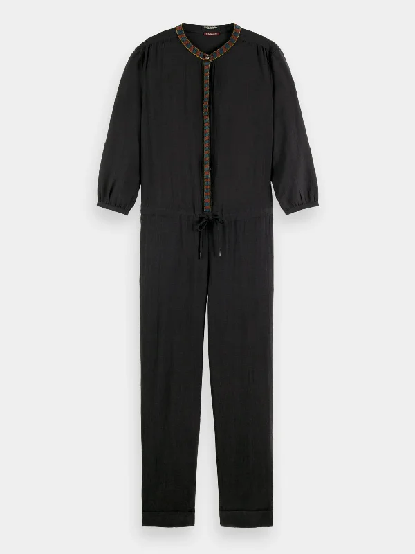 Jumpsuit with arrow head trim