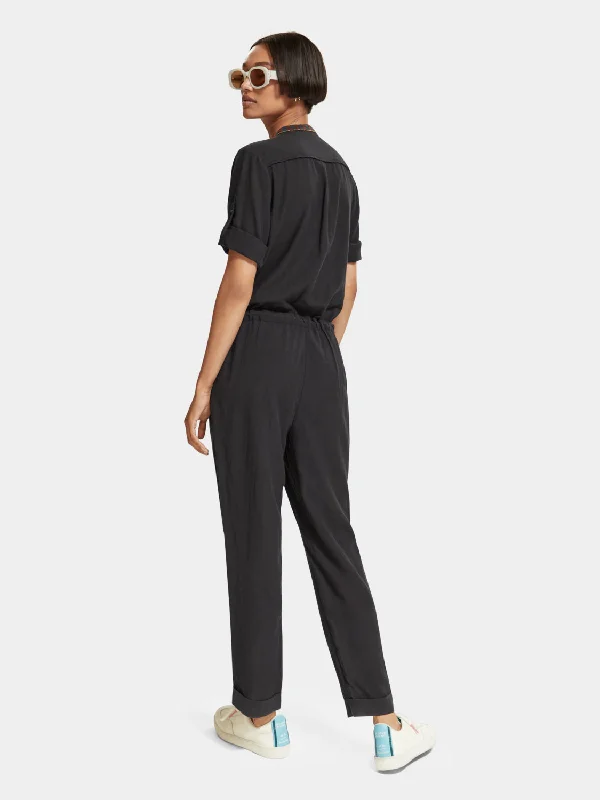 Jumpsuit with arrow head trim